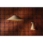 Drawing inspiration from the relaxed style of coastal villages, the Pawley family is carefree yet intentional. The pendant features graceful metalwork with a Historic Bronze finish, including a charming loop below the Soft Sand shade. With an adjustable swivel head, the sconce lets you direct light exactly where needed. Amethyst Home provides interior design, new home construction design consulting, vintage area rugs, and lighting in the Kansas City metro area.