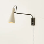 The Yvette plug-in sconce uses a modern lens to reimagine vintage design motifs. The geometry of the metalwork has been simpl