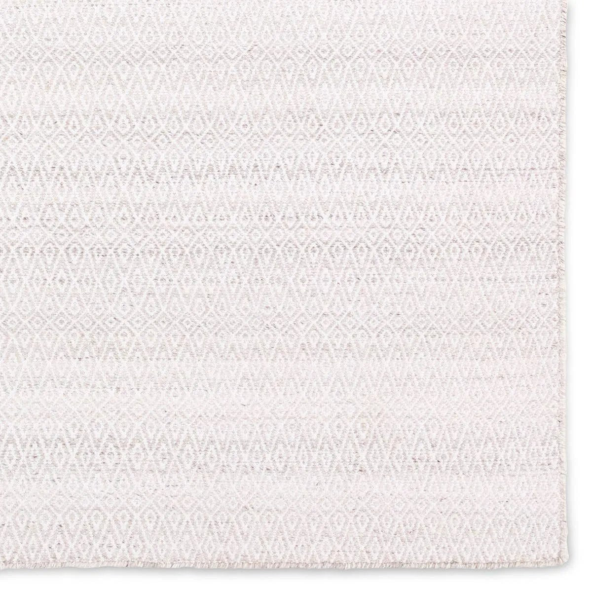 Featuring Almas Imogen Rug by Jaipur Living at Amethyst Home. Handwoven of weather-resistant PET, the Almas Imogen delights with contemporary colorways and designs. The Imogen design showcases a diamond trellis pattern in a colorway of gray and white. The variegated neutral hues provide a subtle distressed look that wears well over time. Crafted of recycled pl. Amethyst Home provides interior design, new home construction design consulting, vintage area rugs, and lighting in the Boston metro area.