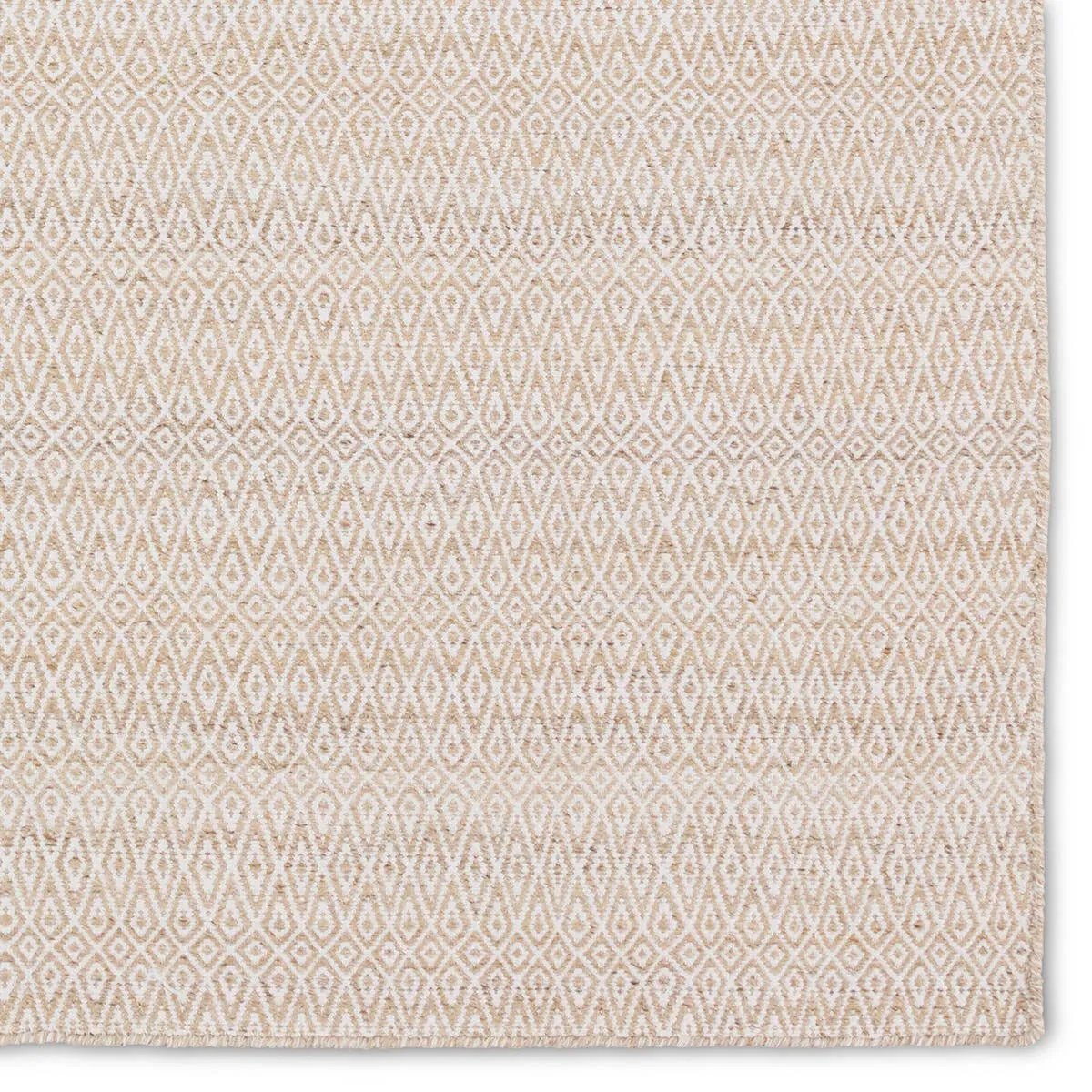 Featuring Almas Imogen Rug by Jaipur Living at Amethyst Home. Handwoven of weather-resistant PET, the Almas Imogen delights with contemporary colorways and designs. The Imogen design showcases a diamond trellis pattern in a colorway of tan and cream. The variegated neutral hues provide a subtle distressed look that wears well over time. Crafted of recycl. Amethyst Home provides interior design, new home construction design consulting, vintage area rugs, and lighting in the Laguna Beach metro area.