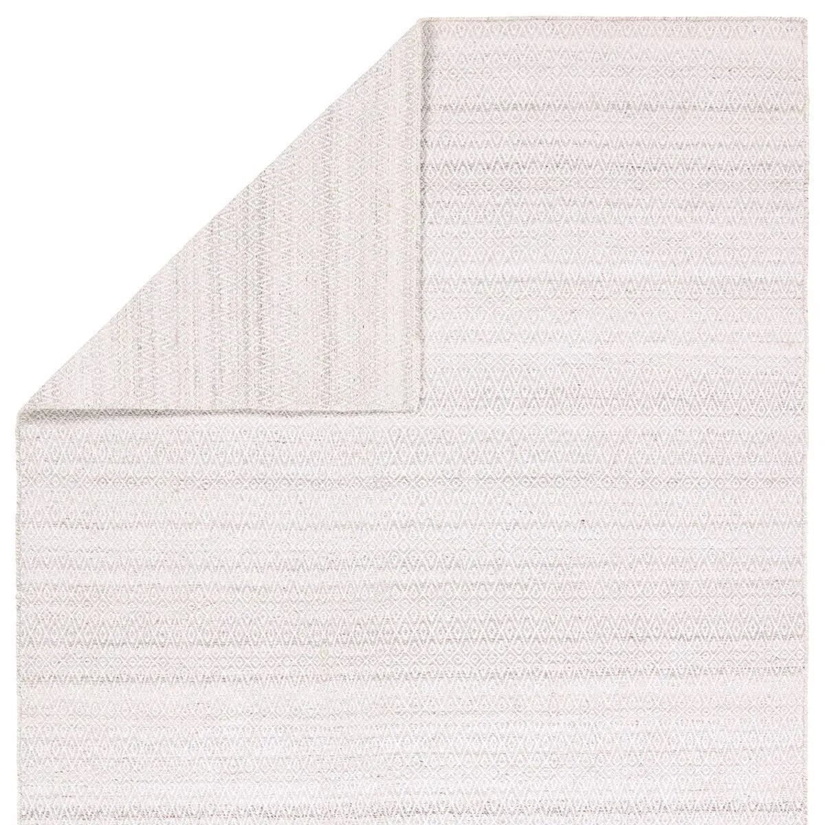 Featuring Almas Imogen Rug by Jaipur Living at Amethyst Home. Handwoven of weather-resistant PET, the Almas Imogen delights with contemporary colorways and designs. The Imogen design showcases a diamond trellis pattern in a colorway of gray and white. The variegated neutral hues provide a subtle distressed look that wears well over time. Crafted of recycled. Amethyst Home provides interior design, new home construction design consulting, vintage area rugs, and lighting in the Park City metro area.