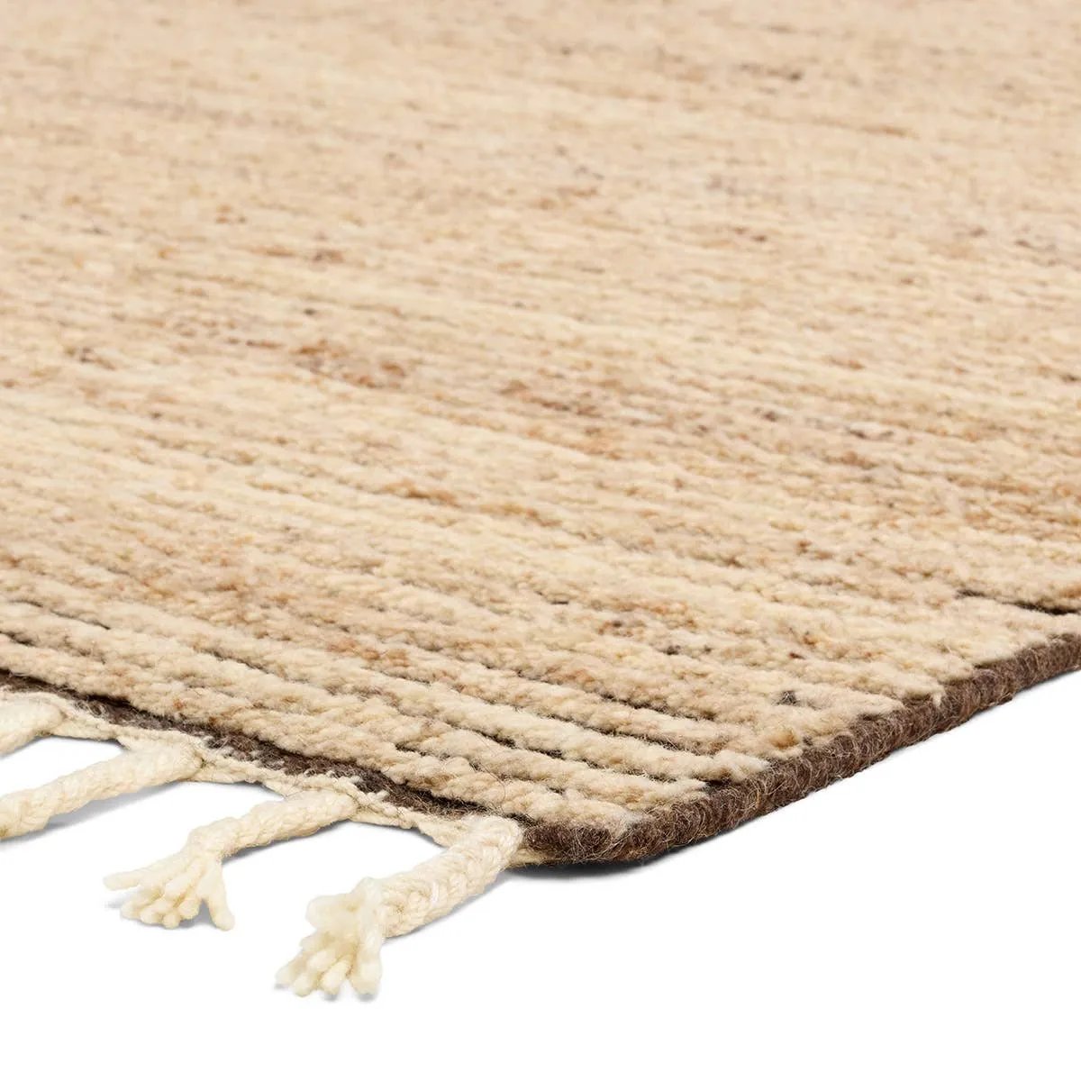 Featuring Alpine Oatmeal Hand-Knotted Rug by Jaipur Living at Amethyst Home. Drawing inspiration from Moroccan textiles, Alpine showcases the beauty in simplicity. Durable wool is hand-knotted onto a cotton foundation to create this high-piled accent piece. Its warm, solid tan design is finished with braided fringe trims for a touch of boho charm. Alpine in. Amethyst Home provides interior design, new home construction design consulting, vintage area rugs, and lighting in the Calabasas metro area.