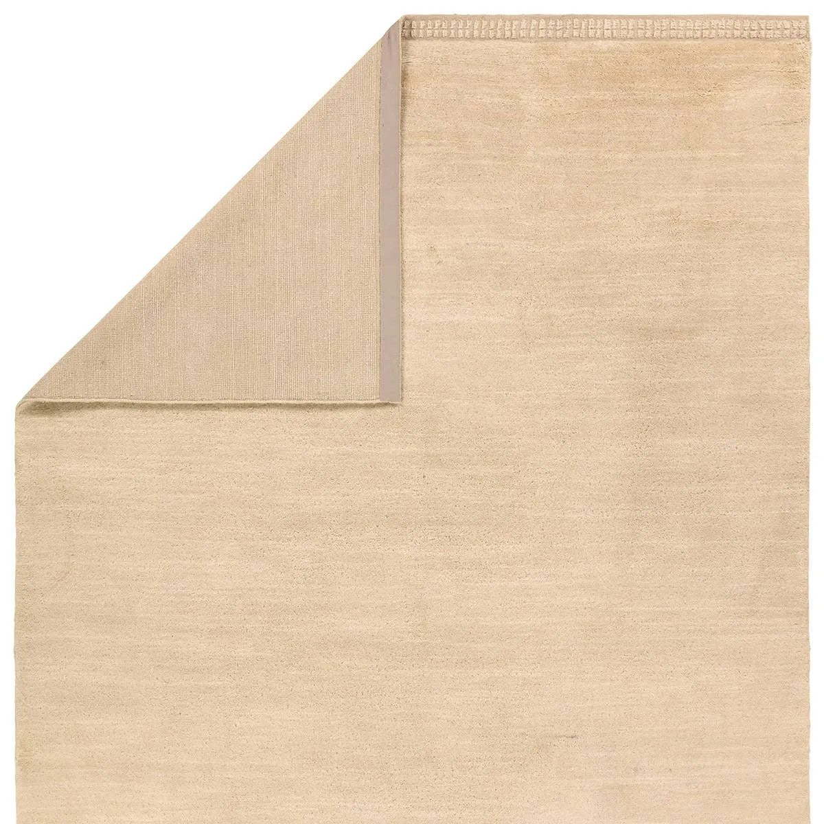 Featuring Colson Hand-Knotted Rug by Jaipur Living at Amethyst Home. The Bekarys Colson features a shaggy texture with a remarkably soft pile that invites relaxation and warmth. Its solid neutral tones provide a versatile backdrop that enhances any decor. This plush, hand-knotted gem offers both tactile pleasure and visual appeal.Hand Knotted100% WoolBKR0. Amethyst Home provides interior design, new home construction design consulting, vintage area rugs, and lighting in the Kansas City metro area.