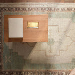 Featuring Enigma Rug by Jaipur Living at Amethyst Home. The Enigma design blends timeless tradition with a vintage-inspired aesthetic. Featuring a striking central medallion, this rug boasts an elegant ivory and white backdrop, accented by light blue detailing. Its classic pattern and gently distressed finish give it an heirloom feel from the very first. Amethyst Home provides interior design, new home construction design consulting, vintage area rugs, and lighting in the Newport Beach metro area.