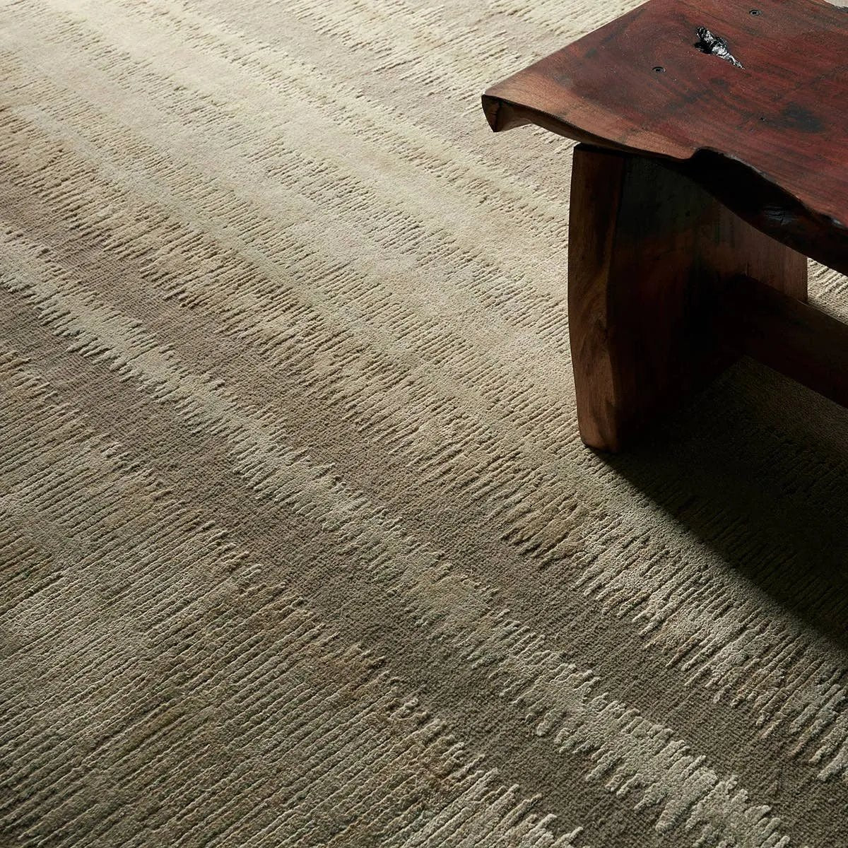 Featuring Jovian Hand-Knotted Rug by Jaipur Living at Amethyst Home. A contemporary interplay of cream and green comes to life in a striking abstract linear design. Crafted from a luxurious blend of viscose and silk, the Jovian design’s luminous sheen accentuates the depth and movement of its pattern. This handknotted piece exudes sophistication and except. Amethyst Home provides interior design, new home construction design consulting, vintage area rugs, and lighting in the Alpharetta metro area.