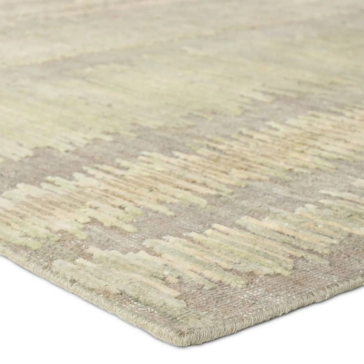 Featuring Jovian Hand-Knotted Rug by Jaipur Living at Amethyst Home. A contemporary interplay of cream and green comes to life in a striking abstract linear design. Crafted from a luxurious blend of viscose and silk, the Jovian design’s luminous sheen accentuates the depth and movement of its pattern. This handknotted piece exudes sophistication and except. Amethyst Home provides interior design, new home construction design consulting, vintage area rugs, and lighting in the Scottsdale metro area.