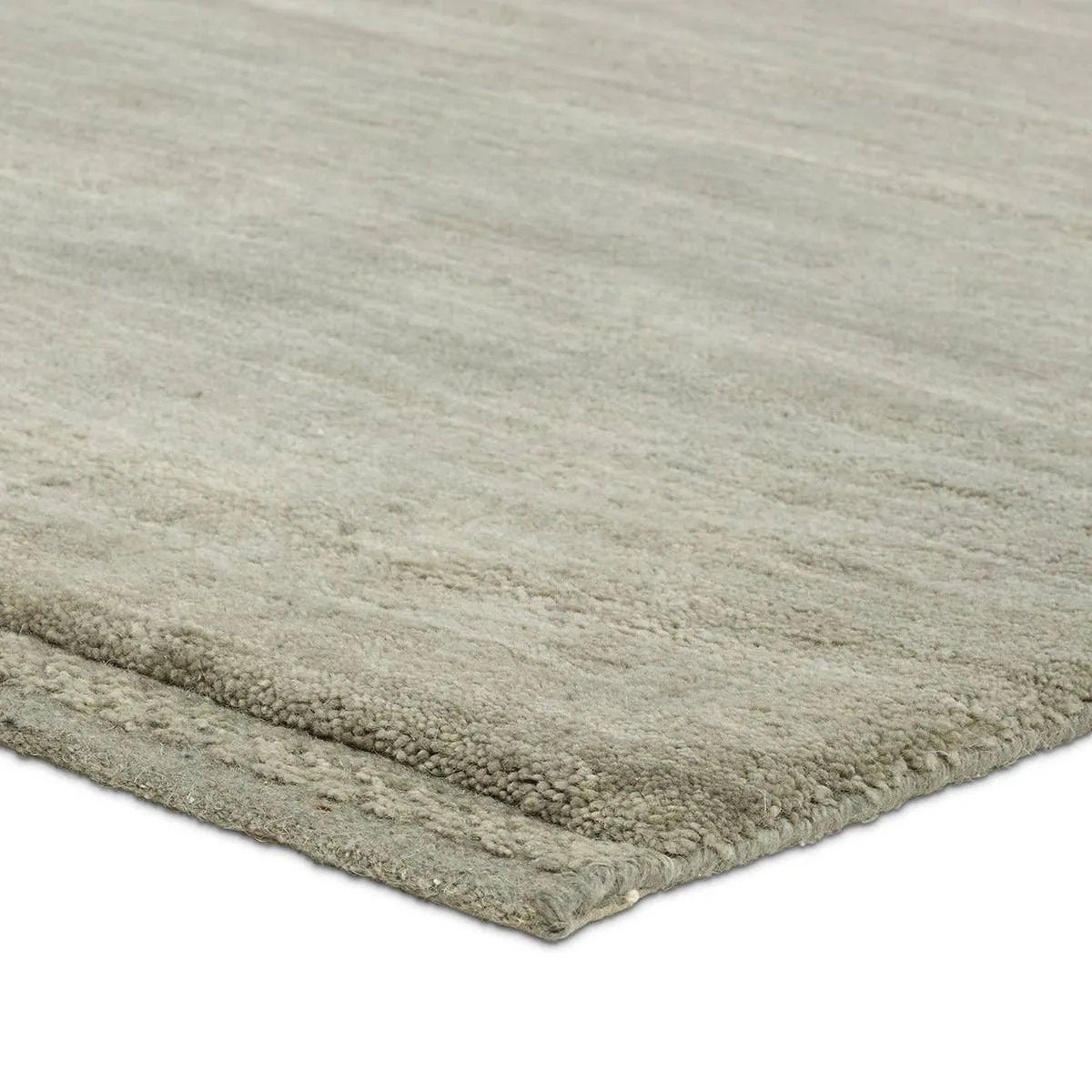 Featuring Judson Hand-Knotted Rug by Jaipur Living at Amethyst Home. The Bekarys Judson features shaggy texture with a remarkably soft pile that invites relaxation and warmth. Its solid neutral tones provide a versatile backdrop that enhances any decor. This plush, hand-knotted gem offers both tactile pleasure and visual appeal.Hand Knotted100% WoolBKR04 . Amethyst Home provides interior design, new home construction design consulting, vintage area rugs, and lighting in the Kansas City metro area.