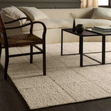 Featuring Leona Coart Rug by Jaipur Living at Amethyst Home. With its lofty, handmade loops, the Coart rug is an inviting, textural essential. Crafted of 100% undyed wool, its natural, relaxed, persona is met with a crisp, contemporary grid pattern.  An outstanding union of artistry and contemporary style, its physical approachability, monochromatic palette. Amethyst Home provides interior design, new home construction design consulting, vintage area rugs, and lighting in the Nashville metro area.