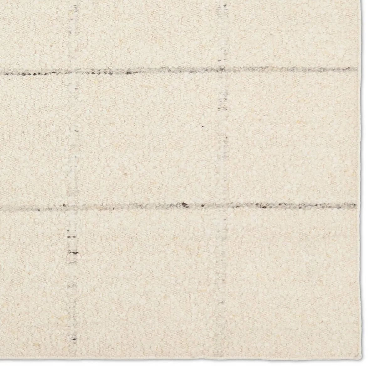 Featuring Leona Coart Rug by Jaipur Living at Amethyst Home. With its lofty, handmade loops, the Coart rug is an inviting, textural essential. Crafted of 100% undyed wool, its natural, relaxed, persona is met with a crisp, contemporary grid pattern.  An outstanding union of artistry and contemporary style, its physical approachability, monochromatic palett. Amethyst Home provides interior design, new home construction design consulting, vintage area rugs, and lighting in the Scottsdale metro area.