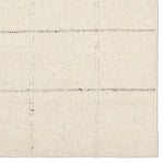 Featuring Leona Coart Rug by Jaipur Living at Amethyst Home. With its lofty, handmade loops, the Coart rug is an inviting, textural essential. Crafted of 100% undyed wool, its natural, relaxed, persona is met with a crisp, contemporary grid pattern.  An outstanding union of artistry and contemporary style, its physical approachability, monochromatic palett. Amethyst Home provides interior design, new home construction design consulting, vintage area rugs, and lighting in the Scottsdale metro area.