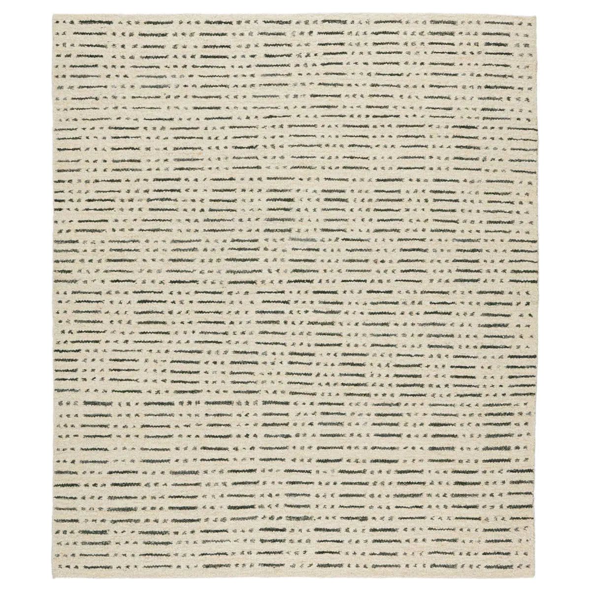 Featuring Leona  Elver Rug by Jaipur Living at Amethyst Home. The texture-rich Leona Elver offers an assortment of updated kilim looks, re-invented with the on-trend shearling style and neutral, modern palettes. The handwoven Elver rug features a globally inspired, gray dot and ticking line pattern on a neutral tan base. This 100% wool accent piece delight. Amethyst Home provides interior design, new home construction design consulting, vintage area rugs, and lighting in the Des Moines metro area.