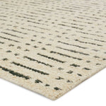 Featuring Leona  Elver Rug by Jaipur Living at Amethyst Home. The texture-rich Leona Elver offers an assortment of updated kilim looks, re-invented with the on-trend shearling style and neutral, modern palettes. The handwoven Elver rug features a globally inspired, gray dot and ticking line pattern on a neutral tan base. This 100% wool accent piece delights . Amethyst Home provides interior design, new home construction design consulting, vintage area rugs, and lighting in the Monterey metro area.