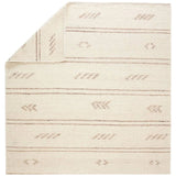 Featuring Leona  Essek Rug by Jaipur Living at Amethyst Home. The texture-rich Leona Essek offers an assortment of updated kilim looks, re-invented with the on-trend shearling style and neutral, modern palettes. The handwoven Essek rug features a globally inspired, light brown, stripe and tribal pattern on a neutral cream base. This 100% wool accent piece. Amethyst Home provides interior design, new home construction design consulting, vintage area rugs, and lighting in the Kansas City metro area.