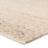 Featuring Leona Folade Rug by Jaipur Living at Amethyst Home. The texture-rich Leona Folade offers an assortment of updated kilim looks, re-invented with the on-trend shearling style and neutral, modern palettes. The handwoven Folade rug features a distressed tan base with hints of trellis beige detailing. This 100% wool accent piece delights in high and l. Amethyst Home provides interior design, new home construction design consulting, vintage area rugs, and lighting in the Washington metro area.