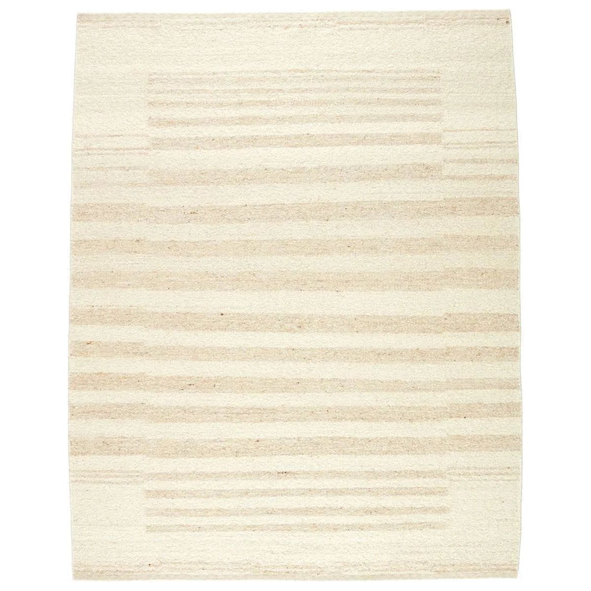 Featuring Leona  Istar Rug by Jaipur Living at Amethyst Home. The texture-rich Leona Istar offers an assortment of updated kilim looks, re-invented with the on-trend shearling style and neutral, modern palettes. The handwoven Istar rug features a globally inspired, light tan, stripe pattern on a neutral cream base. This 100% wool accent piece delights in hi. Amethyst Home provides interior design, new home construction design consulting, vintage area rugs, and lighting in the Charlotte metro area.