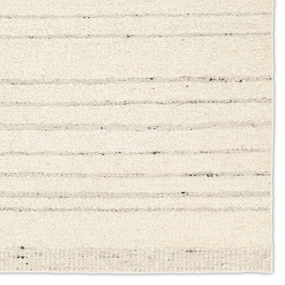 Featuring Leona Rya Rug by Jaipur Living at Amethyst Home. The texture-rich Leona Rya offers an assortment of updated kilim looks, re-invented with the on-trend shearling style and neutral, modern palettes. The handwoven Rya rug features a cream base with taupe stripes. This 100% wool accent piece delights in high and low traffic spaces such as bedrooms, livin. Amethyst Home provides interior design, new home construction design consulting, vintage area rugs, and lighting in the Boston metro area.