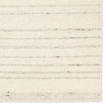 Featuring Leona Rya Rug by Jaipur Living at Amethyst Home. The texture-rich Leona Rya offers an assortment of updated kilim looks, re-invented with the on-trend shearling style and neutral, modern palettes. The handwoven Rya rug features a cream base with taupe stripes. This 100% wool accent piece delights in high and low traffic spaces such as bedrooms, livin. Amethyst Home provides interior design, new home construction design consulting, vintage area rugs, and lighting in the Boston metro area.