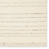 Featuring Leona Rya Rug by Jaipur Living at Amethyst Home. The texture-rich Leona Rya offers an assortment of updated kilim looks, re-invented with the on-trend shearling style and neutral, modern palettes. The handwoven Rya rug features a cream base with taupe stripes. This 100% wool accent piece delights in high and low traffic spaces such as bedrooms, livin. Amethyst Home provides interior design, new home construction design consulting, vintage area rugs, and lighting in the Boston metro area.