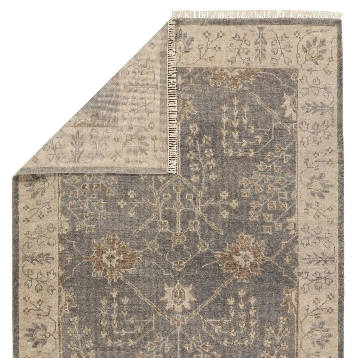 Featuring Liberty Reagan Hand-Knotted Rug by Jaipur Living at Amethyst Home. Inspired by traditional Oushak textiles, this elegant hand-knotted wool rug offers a timeless aesthetic to modern homes. A fresh and muted gray color palette lightens spaces, while the intricate floral pattern and border detail embraces a classic look.Hand Knotted100% WoolLIB02 L. Amethyst Home provides interior design, new home construction design consulting, vintage area rugs, and lighting in the Los Angeles metro area.