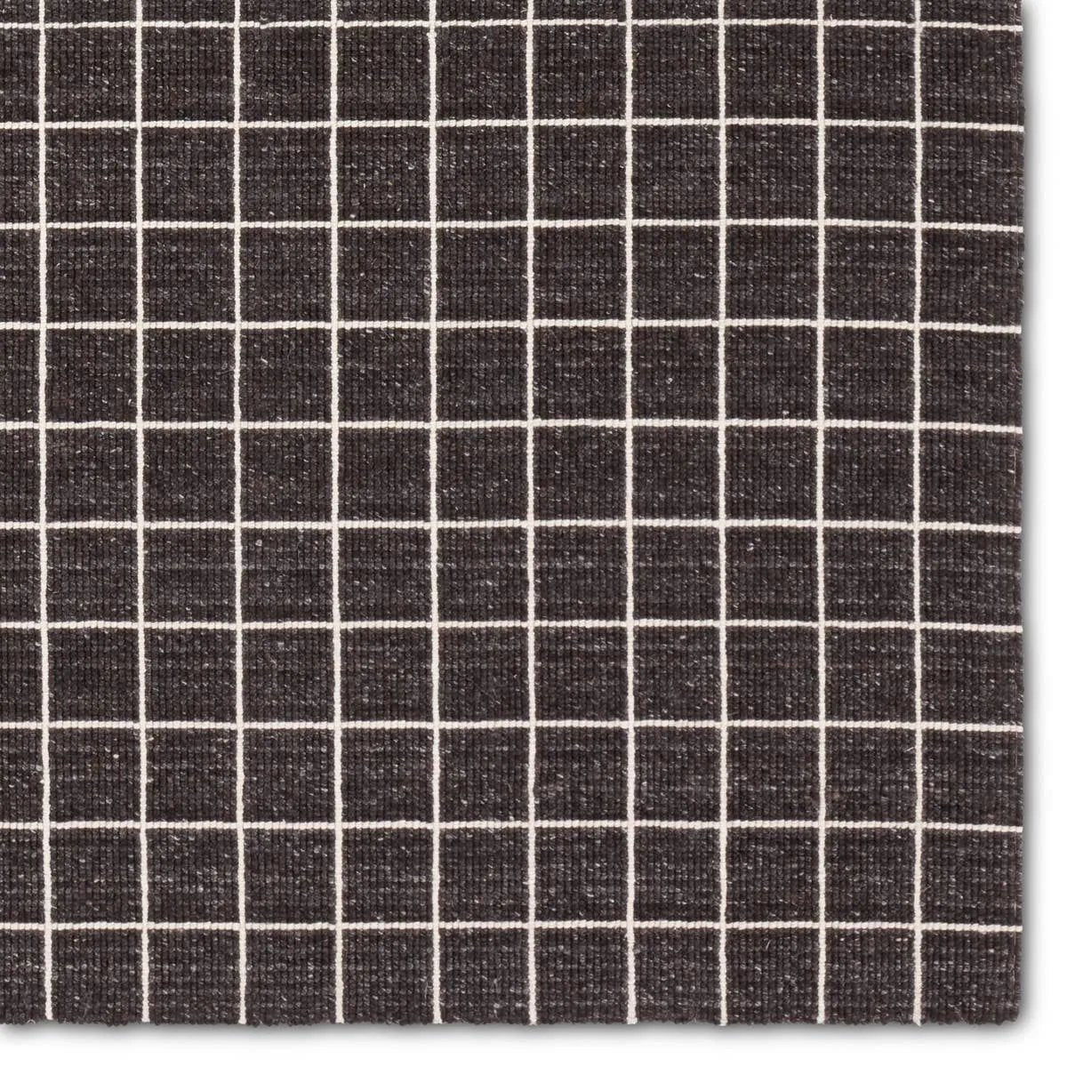 Featuring Oxford Club Rug by Jaipur Living at Amethyst Home. Elegant and casual in the same moment, the Oxford Club by Barclay Butera introduces handwoven accents to an array of spaces. This bolder and darker black colorway complements a range of palettes and styles, perfectly paired for modern and traditional homes alike. The Club design features a grid pat. Amethyst Home provides interior design, new home construction design consulting, vintage area rugs, and lighting in the Monterey metro area.