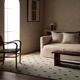 Featuring Quinlan Hand-Knotted Rug by Jaipur Living at Amethyst Home. The Quinlan design reinvents timeless geometric patterns, fusing classic charm with a modern edge. Soft beige tones, punctuated by a blue accent, elevate any mid-century modern space. Handcrafted from naturally stain-resistant wool, this rug handles medium-traffic areas, kids, and pets w. Amethyst Home provides interior design, new home construction design consulting, vintage area rugs, and lighting in the Alpharetta metro area.