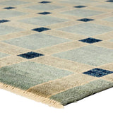 Featuring Quinlan Hand-Knotted Rug by Jaipur Living at Amethyst Home. The Quinlan design reinvents timeless geometric patterns, fusing classic charm with a modern edge. Soft beige tones, punctuated by a blue accent, elevate any mid-century modern space. Handcrafted from naturally stain-resistant wool, this rug handles medium-traffic areas, kids, and pets with . Amethyst Home provides interior design, new home construction design consulting, vintage area rugs, and lighting in the Austin metro area.