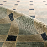 Featuring Quinlan Hand-Knotted Rug by Jaipur Living at Amethyst Home. The Quinlan design reinvents timeless geometric patterns, fusing classic charm with a modern edge. Soft beige tones, punctuated by a blue accent, elevate any mid-century modern space. Handcrafted from naturally stain-resistant wool, this rug handles medium-traffic areas, kids, and pets wi. Amethyst Home provides interior design, new home construction design consulting, vintage area rugs, and lighting in the Nashville metro area.