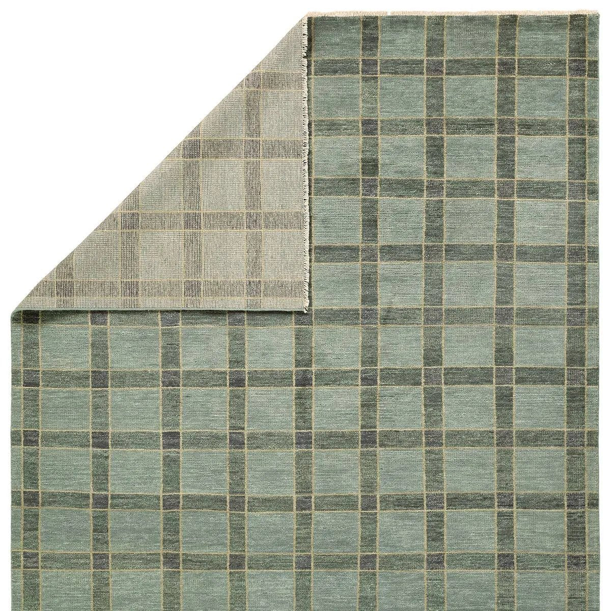 Featuring Quinlan Hand-Knotted Rug by Jaipur Living at Amethyst Home. The Quinlan design reinvents timeless geometric grid patterns, fusing classic charm with a modern edge. Its beautiful blue hue elevates any mid-century modern space, while the 100% wool construction offers natural stain resistance. Stylish and durable, this piece is designed to stand the test. Amethyst Home provides interior design, new home construction design consulting, vintage area rugs, and lighting in the Tampa metro area.
