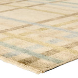 Featuring Raza Hand-Knotted Rug by Jaipur Living at Amethyst Home. The Raza design reinvents the timeless plaid pattern, fusing classic charm with a modern edge. Soft beige tones, punctuated by a blue accent, elevate any mid-century modern space. Handcrafted from naturally stain-resistant wool, this rug handles medium-traffic areas, kids, and pets with ease. A . Amethyst Home provides interior design, new home construction design consulting, vintage area rugs, and lighting in the Miami metro area.