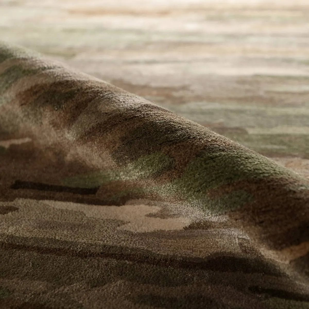 Featuring Ryenn Rug by Jaipur Living at Amethyst Home. Infused with a whimsical spirit and sophisticated flair, the Genesis Ryenn brings an artistic edge to any contemporary home. The Ryenn design features an abstract, grounding green and brown pattern, enhanced with a lustrous sheen reminiscent of shimmering water reflections.Hand Tufted60% Wool 40% Viscos. Amethyst Home provides interior design, new home construction design consulting, vintage area rugs, and lighting in the Nashville metro area.