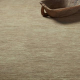 Featuring Saga Origin Hand-Knotted Rug by Jaipur Living at Amethyst Home. The sophisticated Saga Origin lends balance and a relaxed, grounding vibe to modern interiors. The Origin area rug anchors a space with a solid, subtly striated design in a dark taupe colorway. Hand knotted by skilled artisans, this durable wool accent marries simplicity and luxury with . Amethyst Home provides interior design, new home construction design consulting, vintage area rugs, and lighting in the Austin metro area.