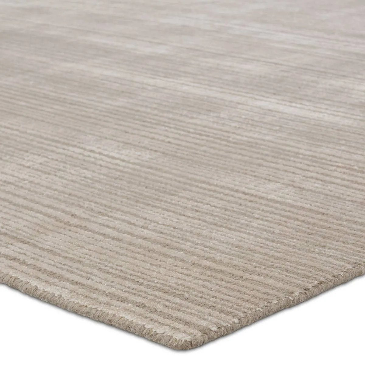 Featuring Second Sunset Gradient Rug by Jaipur Living at Amethyst Home. The easy-to-decorate, earthy tones of the Second Sunset Gradient prove that simplicity can sometimes be striking. The Gradient rug is hand loomed of durable wool and jasmine for a sumptuous and inviting hand. The variation in taupe hues of this lustrous rug creates stunning depth and dimen. Amethyst Home provides interior design, new home construction design consulting, vintage area rugs, and lighting in the Boston metro area.