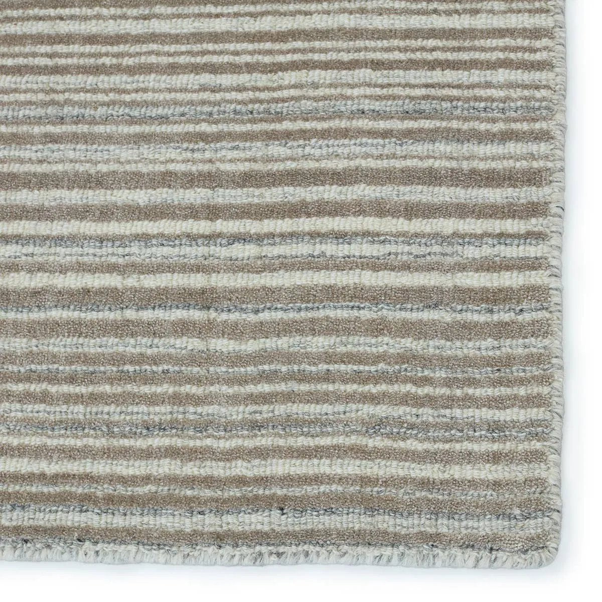 Featuring Second Sunset  Gradient Rug by Jaipur Living at Amethyst Home. The easy-to-decorate, earthy tones of the Second Sunset Gradient prove that simplicity can sometimes be striking. The Gradient rug is hand loomed of durable wool and jasmine for a sumptuous and inviting hand. The variation in the light taupe, ivory, and gray tones of this lustrous rug. Amethyst Home provides interior design, new home construction design consulting, vintage area rugs, and lighting in the Washington metro area.
