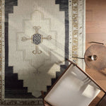 Featuring Stellar Rug by Jaipur Living at Amethyst Home. The Stellar design merges timeless tradition with a vintage-inspired aesthetic. Featuring a striking central medallion, this rug is set against an elegant beige and black backdrop, accented by rich green detailing. Its classic pattern, paired with a gently distressed finish, creates an heirloom qualit. Amethyst Home provides interior design, new home construction design consulting, vintage area rugs, and lighting in the Nashville metro area.