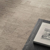 Featuring Tenley Rug by Jaipur Living at Amethyst Home. The hand-tufted Labyrinth Tenley presents abstract designs crafted from plush wool with a cut and looped pile, creating a rich, tactile texture. The Tenley design showcases a bold, geometric pattern with a modern brutalist influence in shades of gray and taupe, effortlessly adding depth and sophisticat. Amethyst Home provides interior design, new home construction design consulting, vintage area rugs, and lighting in the Calabasas metro area.