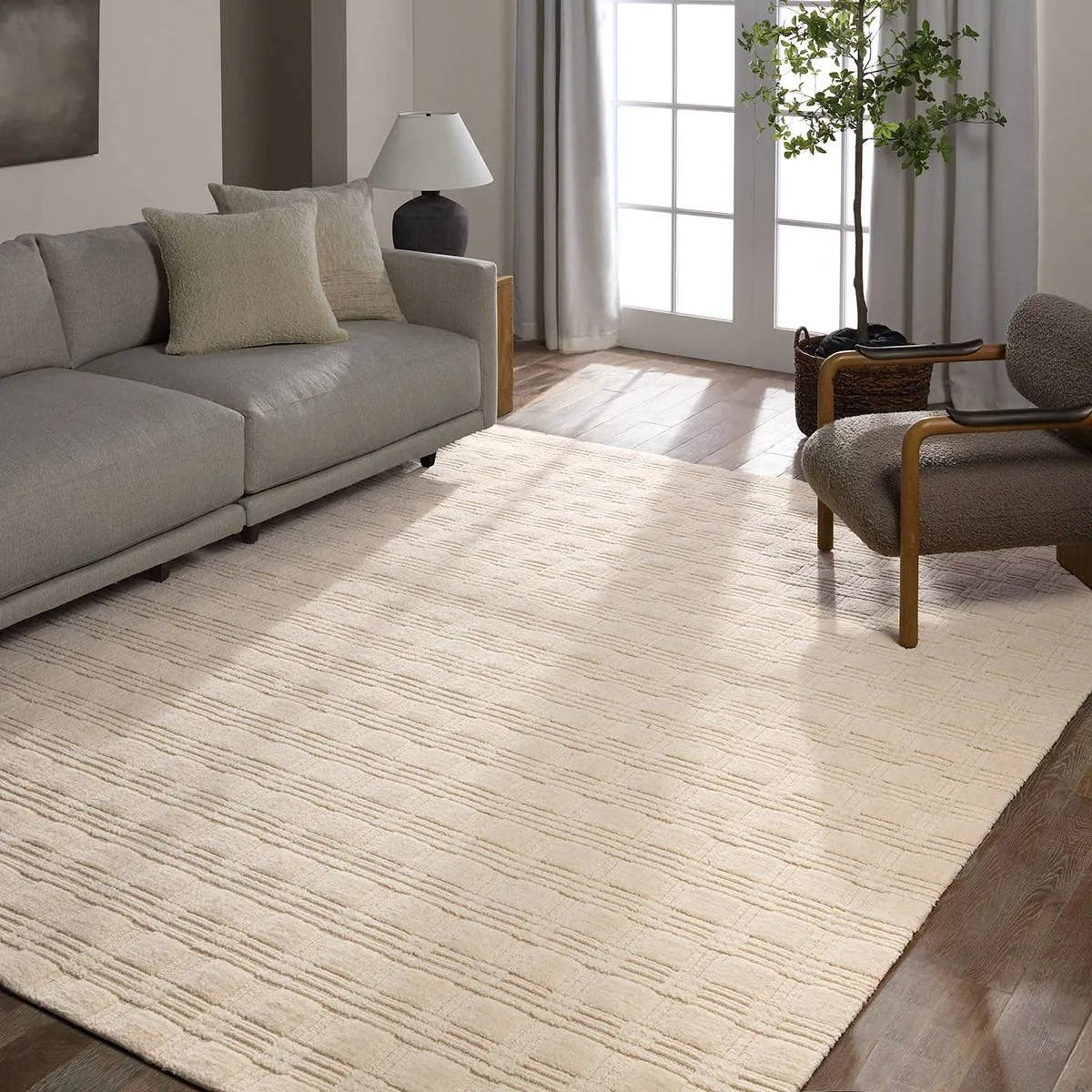 Featuring Tokaree Rowena Rug by Jaipur Living at Amethyst Home. Reminiscent of a basketweave, The Tokaree Rowena demonstrates sophistication and simplicity in a tonal taupe checker pattern.  Handwoven of 100% wool, varied pile height creates a unique texture and luxurious depth while maintaining durability and quality that are synonymous with our artisans in. Amethyst Home provides interior design, new home construction design consulting, vintage area rugs, and lighting in the Monterey metro area.