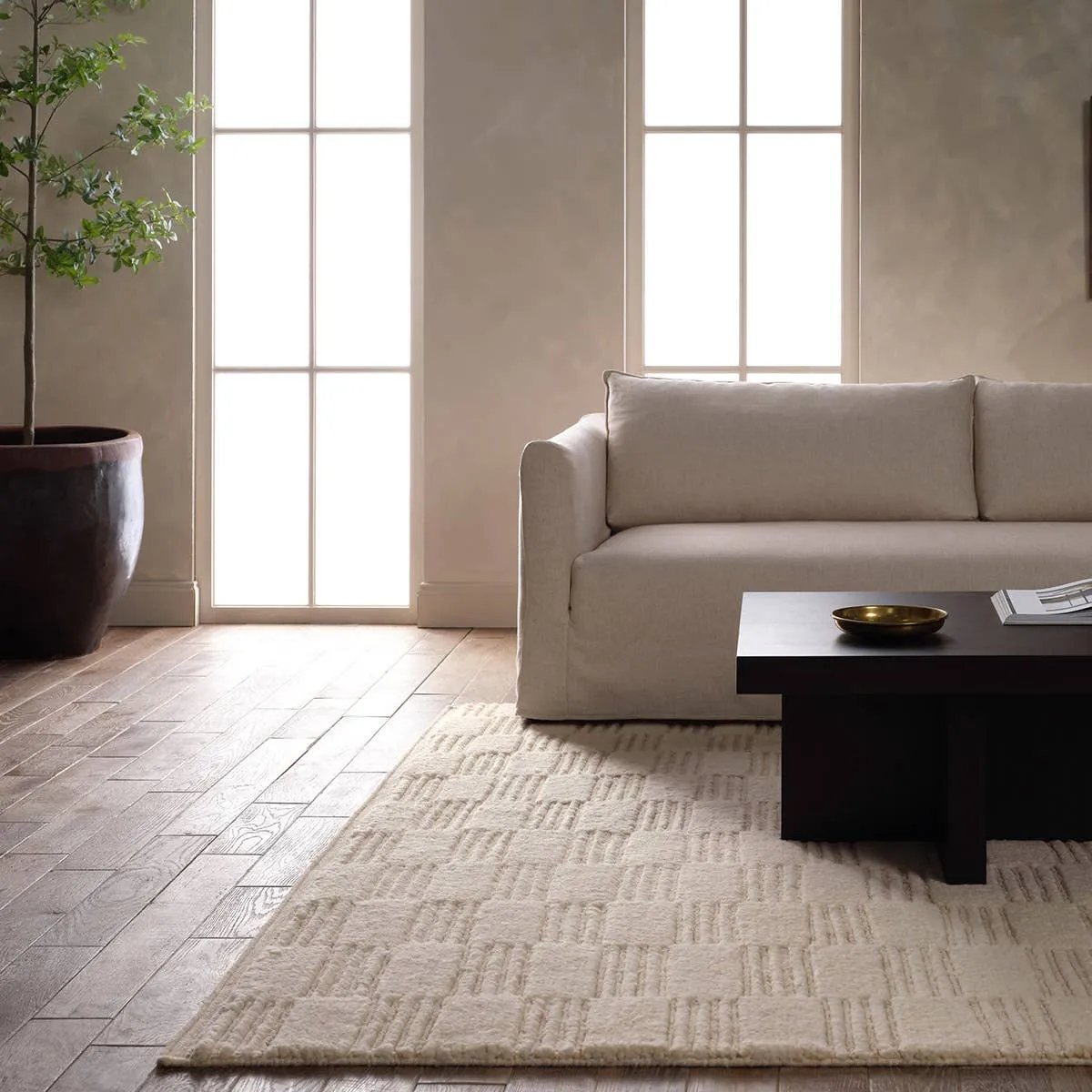 Featuring Totto Hand-Knotted Rug by Jaipur Living at Amethyst Home. A contemporary twist on traditional Afghani hand-knotted textiles. The Keoka is crafted entirely from wool, featuring a ribbed construction that accentuates its dynamic checkerboard pattern with unique linear details. Complete with a dhurrie border, the Totto design adds a touch of global flai. Amethyst Home provides interior design, new home construction design consulting, vintage area rugs, and lighting in the Boston metro area.