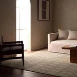 Featuring Vaila Hand-Knotted Rug by Jaipur Living at Amethyst Home. The Vaila design reinvents timeless geometric grid patterns, fusing classic charm with a modern edge. Soft beige tones elevate any mid-century modern space, while naturally stain-resistant wool handles medium-traffic areas, kids, and pets with ease. A durable yet stylish foundation, this pi. Amethyst Home provides interior design, new home construction design consulting, vintage area rugs, and lighting in the Park City metro area.