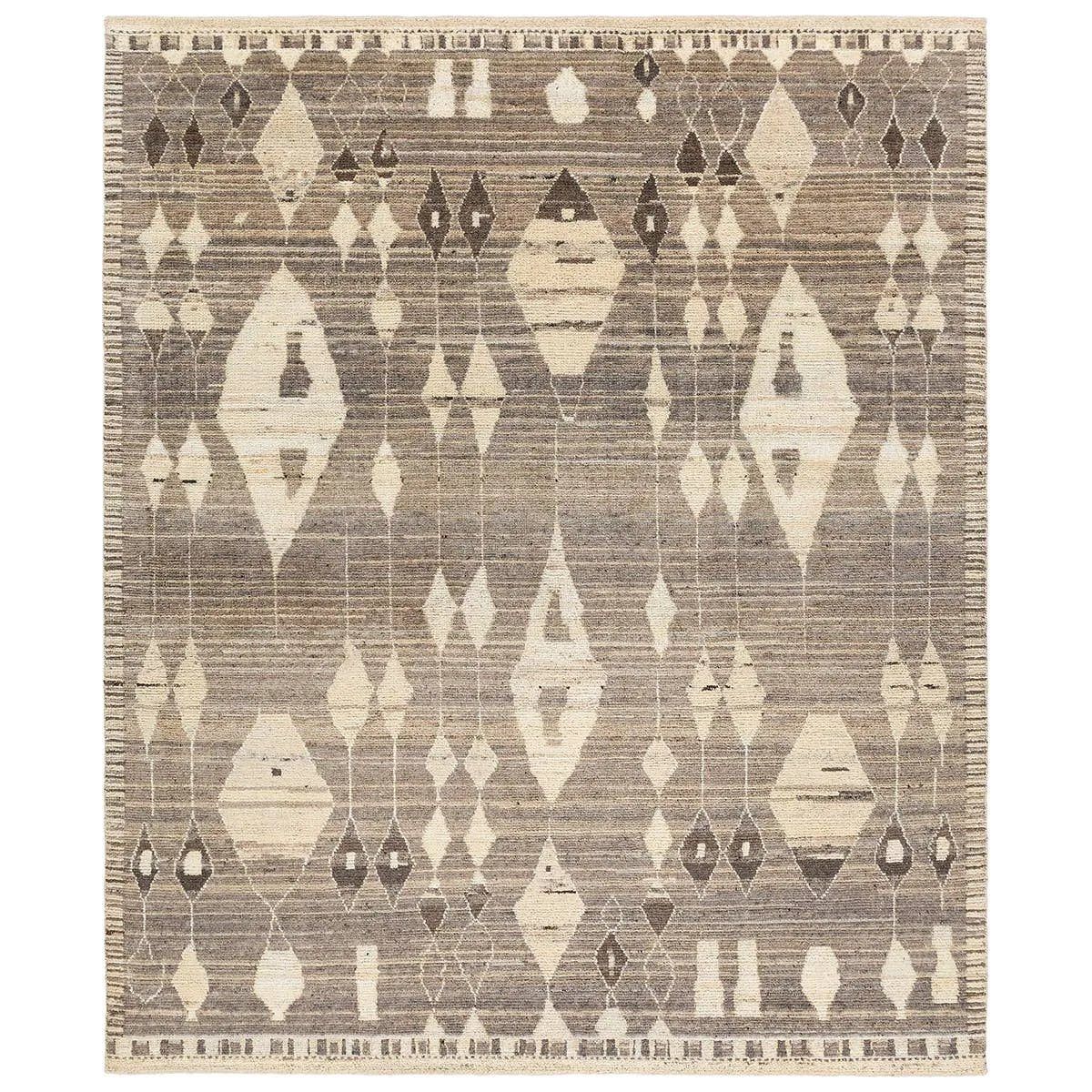 Featuring Zaira Tonnara Hand-Knotted Rug by Jaipur Living at Amethyst Home. Enrich living spaces with the exotic allure of the Zaira Collection - a fusion of modern Moroccan designs and unparalleled craftsmanship. Handknotted in India with 22 knots per square inch, these rugs exude luxury and artistry. The Tonnara rug showcases an intriguing diamond pattern. Amethyst Home provides interior design, new home construction design consulting, vintage area rugs, and lighting in the Calabasas metro area.