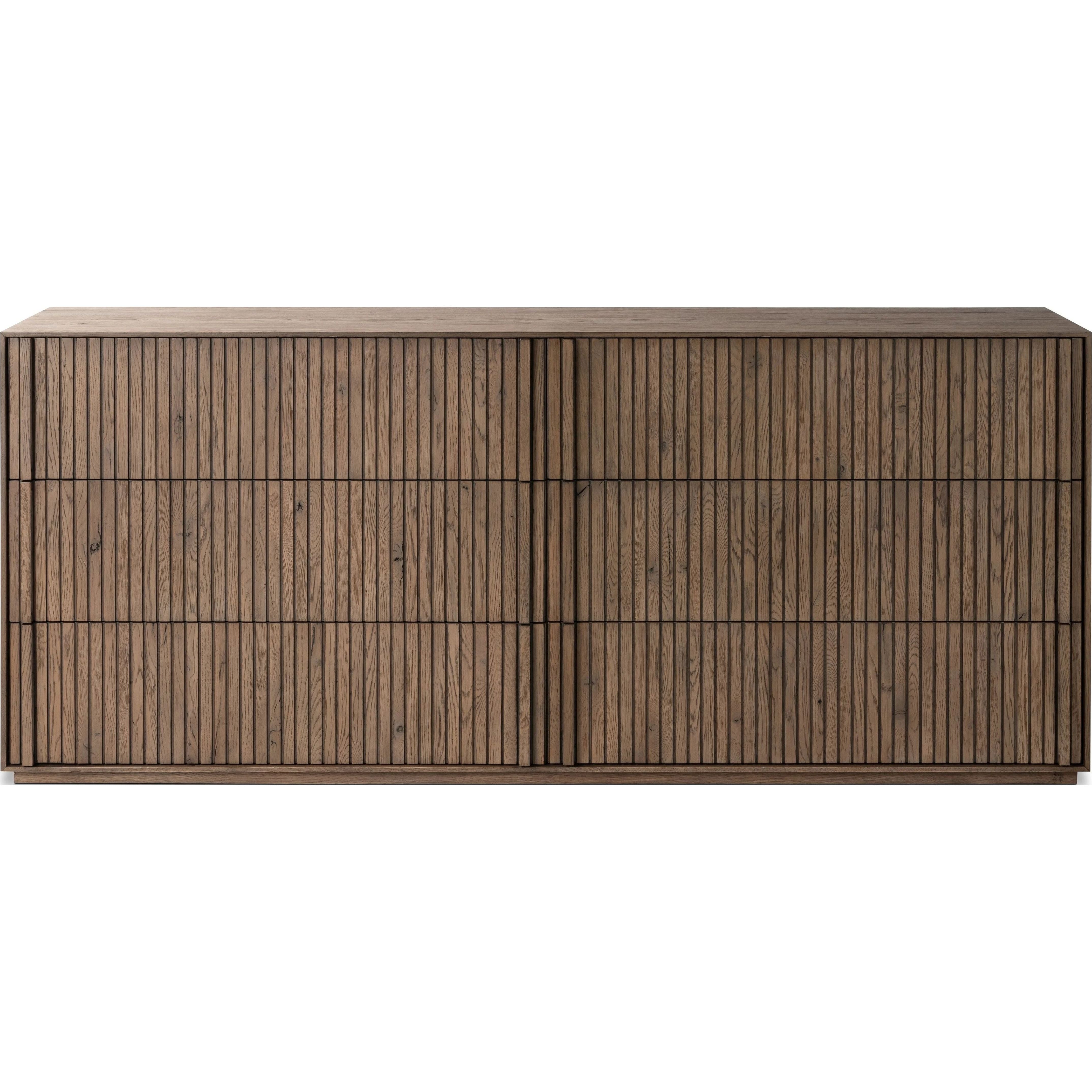 Featuring Leo Rustic Grey 6 Drawer Dresser by Four Hands at Amethyst Home. Designed by Thomas Bina and Ronald Sasson, a design partnership blending both modern minimalist and Brazilian influences. Crafted from solid oak, this clean-lined dresser features vertical reed detailing on the drawer fronts with wooden pull detailing on the outer edges. Drawers are . Amethyst Home provides interior design, new home construction design consulting, vintage area rugs, and lighting in the San Diego metro area.