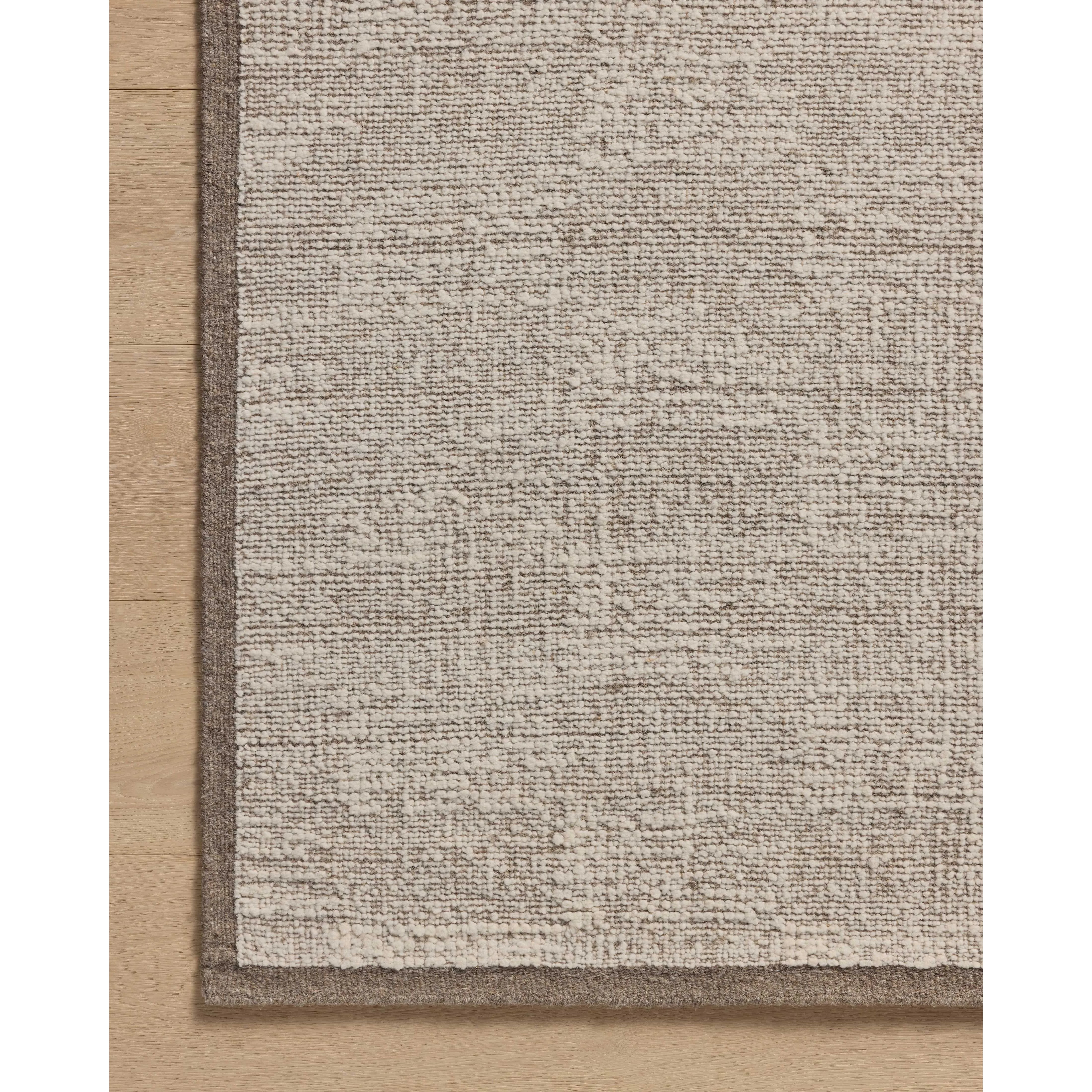 Featuring Amber Lewis x Loloi Dakota Stone / Ivory Rug by Loloi at Amethyst Home. The Dakota Collection by Amber Lewis x Loloi is a flatweave-style area rug with a muted checkerboard pattern framed with a deeper-toned border. The rug is hand-woven of wool and cotton for a durable, natural warmth in living rooms, bedrooms, and more. This collection is handmade. Amethyst Home provides interior design, new home construction design consulting, vintage area rugs, and lighting in the Seattle metro area.