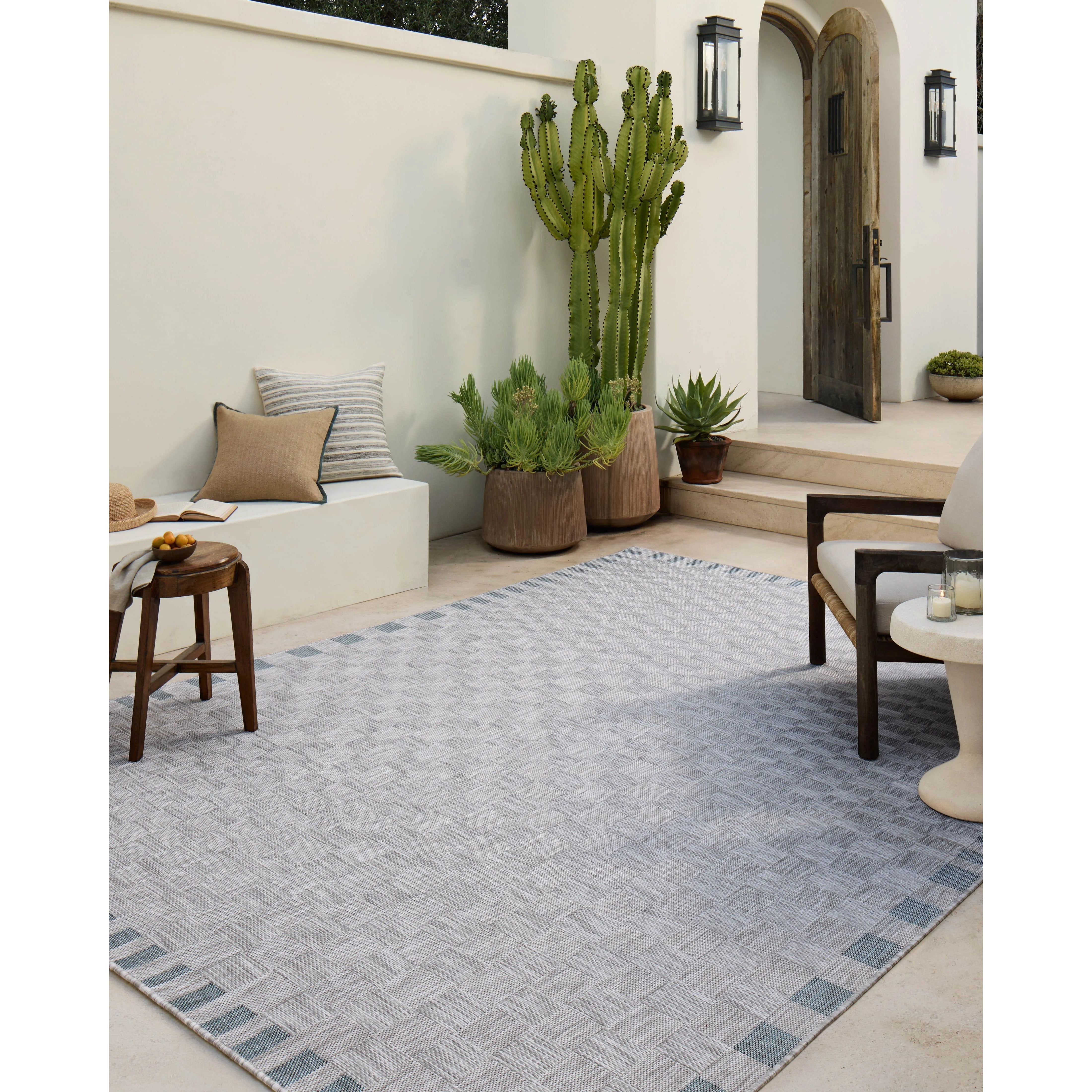Featuring Amber Lewis x Loloi Topanga Silver / Blue Rug by Loloi at Amethyst Home. Inspired by the scenic mountain town in California, the Topanga Collection is an indoor/outdoor rug made of durable polypropylene that resembles natural fibers but is much more ready for sun, rain, and high-traffic use. The rug's modern construction also makes it easy to clea. Amethyst Home provides interior design, new home construction design consulting, vintage area rugs, and lighting in the Calabasas metro area.