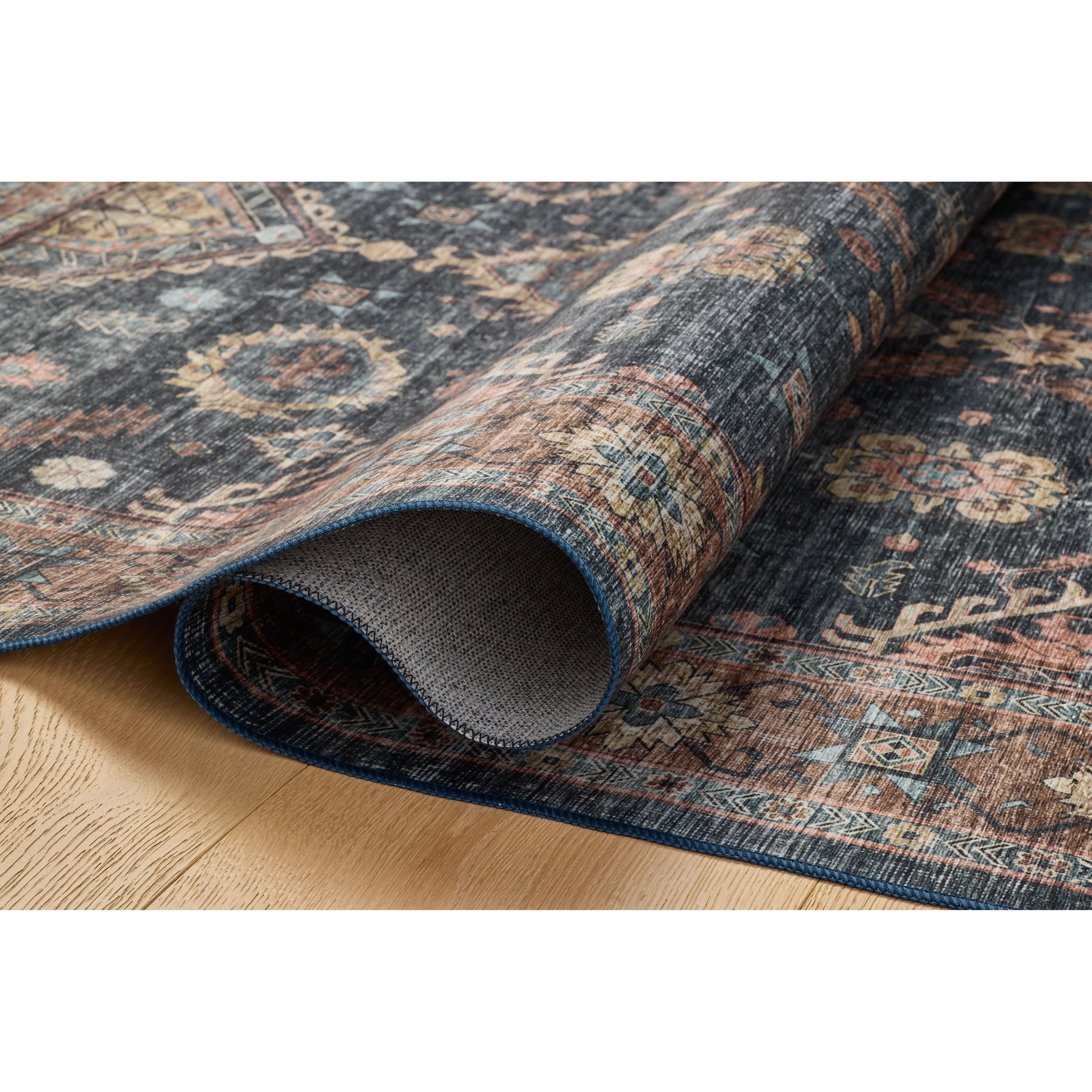 Featuring Anniston Machine Washable Denim / Sunset Rug by Loloi at Amethyst Home. The Anniston Collection is a washable rug with traditional motifs in beautifully saturated and distressed tones. This durable area rug is power-loomed of polyester in China and designed for the busiest rooms of the home—living rooms, bedrooms, kitchens, hallways, and more. Amethyst Home provides interior design, new home construction design consulting, vintage area rugs, and lighting in the Salt Lake City metro area.