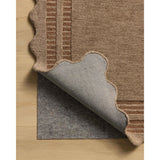 Featuring Chris Loves Julia × Loloi Scottie Mocha / Clay Rug by Loloi at Amethyst Home. The Scottie Collection from Chris Loves Julia x Loloi is a hand-tufted wool area rug with a playful scalloped edge and lower-pile, striped border for a touch of structure. The rugs overall pile is thick and plush, available in easygoing earth tones and neutral colorw. Amethyst Home provides interior design, new home construction design consulting, vintage area rugs, and lighting in the Newport Beach metro area.