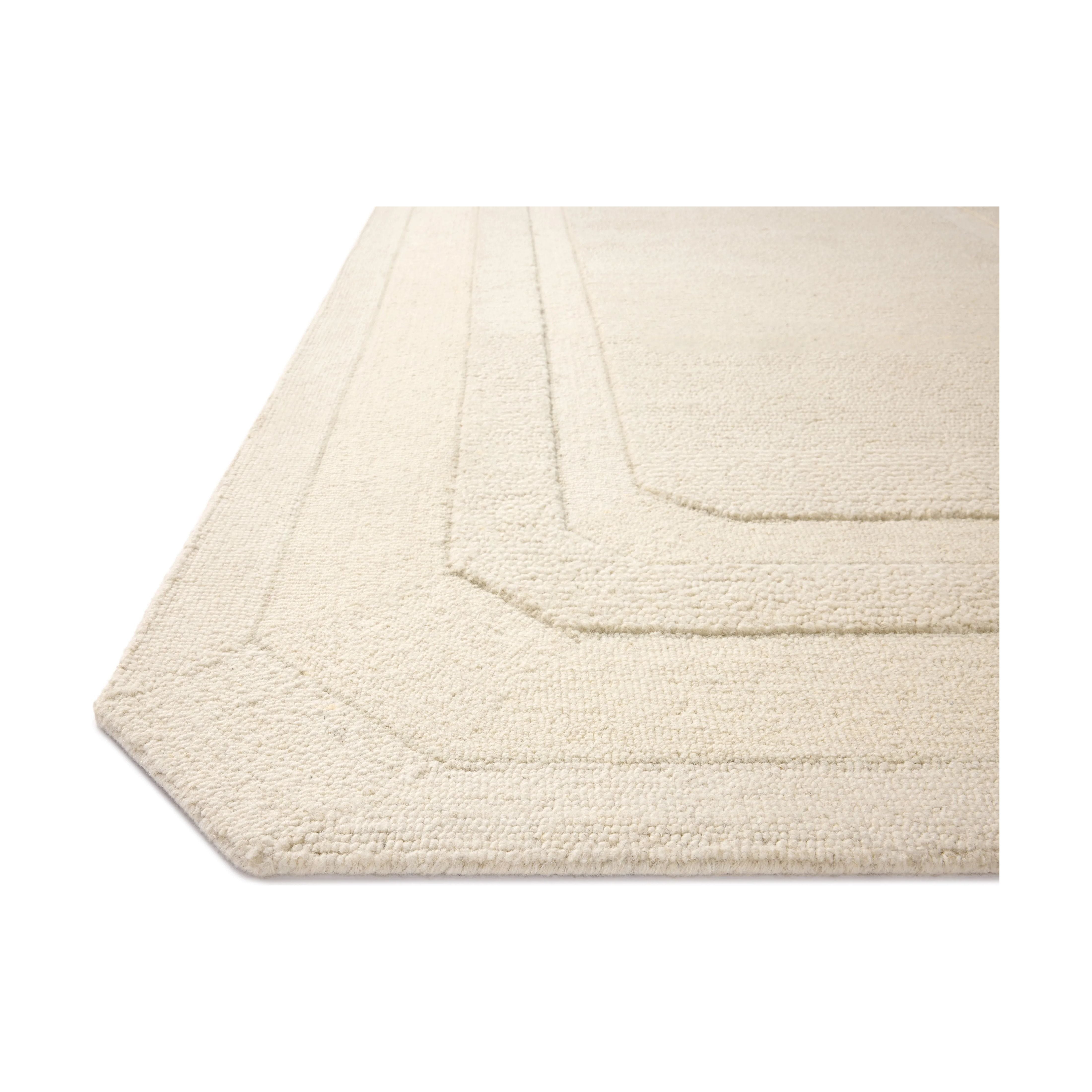 Featuring Clayton Ivory Rug by Loloi at Amethyst Home. The Clayton Collection is a hand-tufted, solid-toned wool area rug with angled edges for a modern twist on traditional home decor. Clayton adds even more dimension with a luxurious high/low looped pile that is perfect in living rooms, bedrooms, and more. This collection is made in India and Goodweave-cert. Amethyst Home provides interior design, new home construction design consulting, vintage area rugs, and lighting in the Seattle metro area.