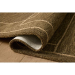 Featuring Jeremiah Brent x Loloi Barrow Olive / Natural Rug by Loloi at Amethyst Home. The Barrow Collection by Jeremiah Brent x Loloi is a hand-tufted area rug with a bold linear design inspired by modern art and classical architecture. The rugs pile is a blend of wool and jute for a stable, substantial feel that can ground living rooms, dining rooms, bedrooms. Amethyst Home provides interior design, new home construction design consulting, vintage area rugs, and lighting in the Omaha metro area.