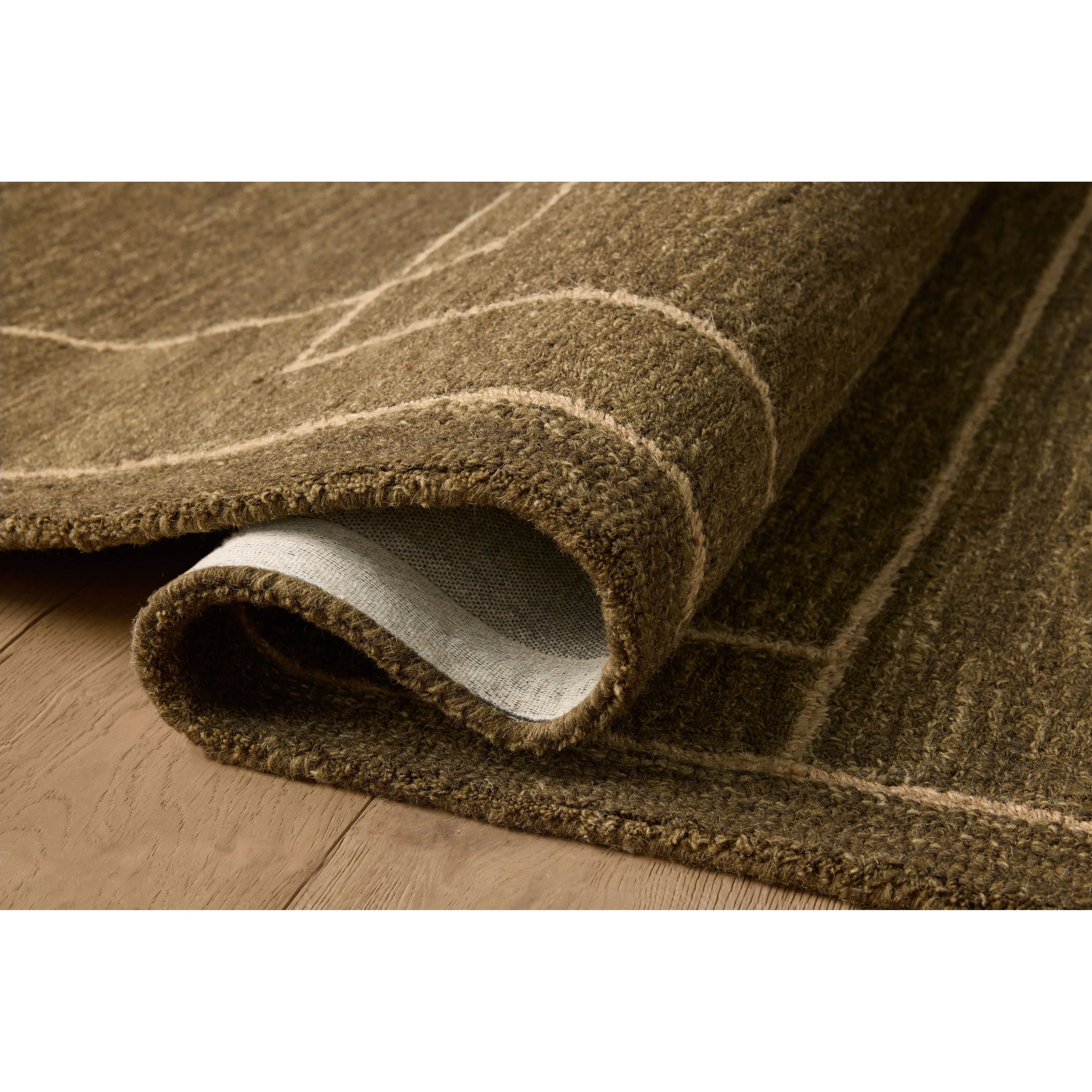 Featuring Jeremiah Brent x Loloi Barrow Olive / Natural Rug by Loloi at Amethyst Home. The Barrow Collection by Jeremiah Brent x Loloi is a hand-tufted area rug with a bold linear design inspired by modern art and classical architecture. The rugs pile is a blend of wool and jute for a stable, substantial feel that can ground living rooms, dining rooms, bedrooms. Amethyst Home provides interior design, new home construction design consulting, vintage area rugs, and lighting in the Omaha metro area.