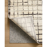 Featuring Jeremiah Brent x Loloi Bleecker Ivory / Charcoal Rug by Loloi at Amethyst Home. The Bleecker Collection by Jeremiah Brent x Loloi is a soft, power-loomed rug in warm colorways that change in different lighting. With high-contrast linear patterns and careful distressing, Bleecker represents Jeremiah love of modern design. This collection is ma. Amethyst Home provides interior design, new home construction design consulting, vintage area rugs, and lighting in the Salt Lake City metro area.