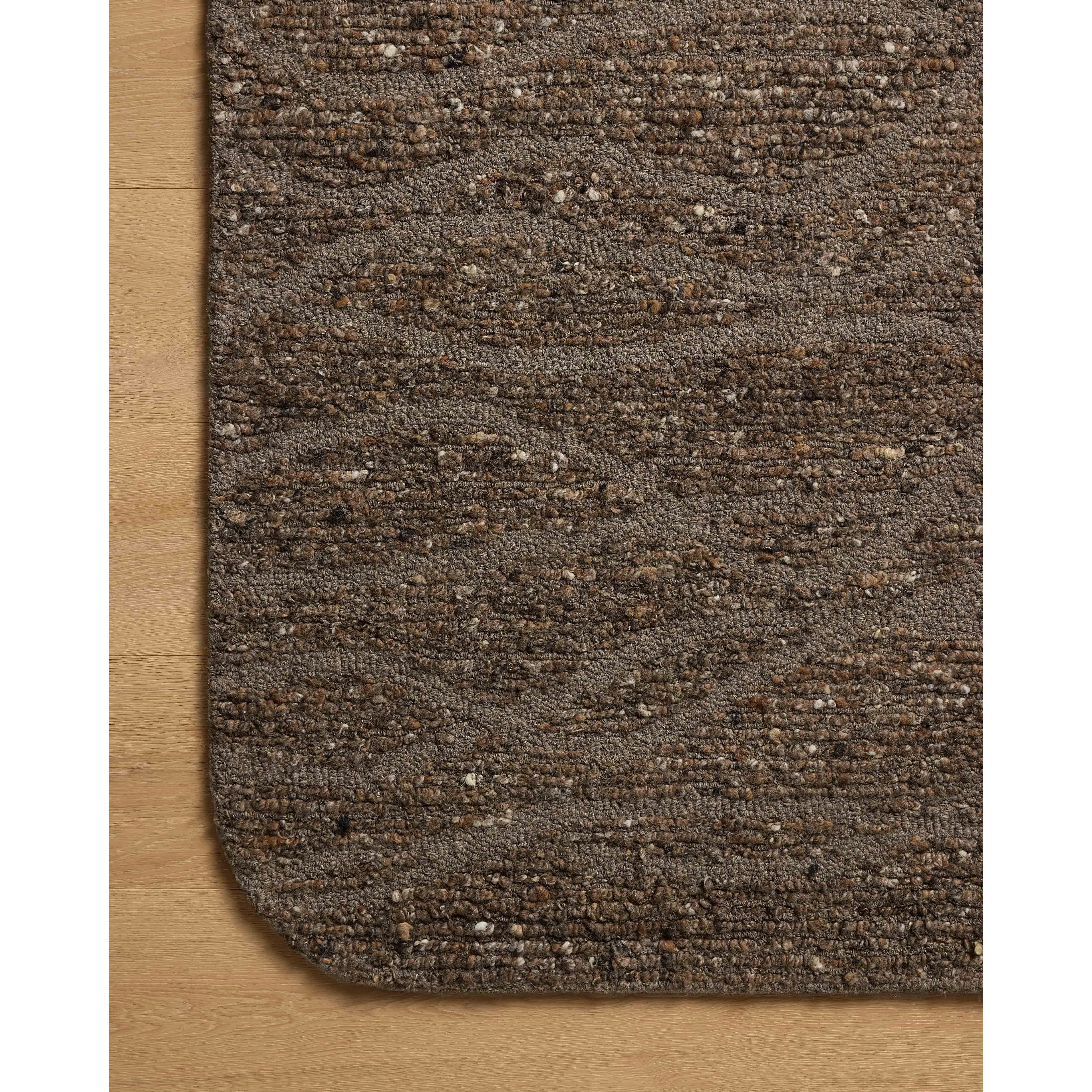 Featuring Otis Bark / Brown Rug by Loloi at Amethyst Home. The Otis Collection is a hand-tufted area rug with an organic design and uniquely rounded edges. This design-forward collection features loose linear patterns in heathered, natural colors to ground living rooms, bedrooms, dining rooms, and more. This collection is hand-tufted of wool and other fibers . Amethyst Home provides interior design, new home construction design consulting, vintage area rugs, and lighting in the Seattle metro area.