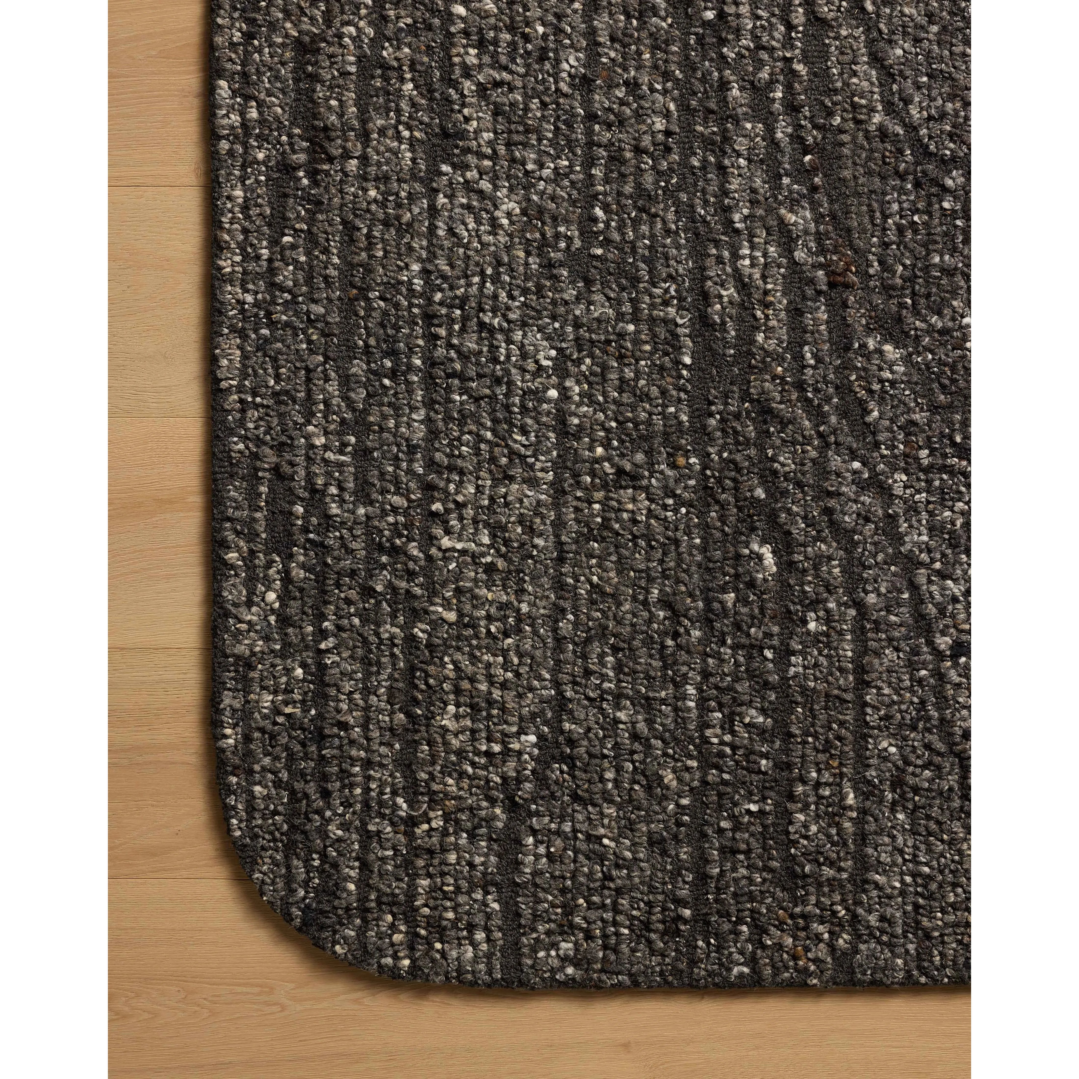 Featuring Otis Charcoal / Granite Rug by Loloi at Amethyst Home. The Otis Collection is a hand-tufted area rug with an organic design and uniquely rounded edges. This design-forward collection features loose linear patterns in heathered, natural colors to ground living rooms, bedrooms, dining rooms, and more. This collection is hand-tufted of wool and other. Amethyst Home provides interior design, new home construction design consulting, vintage area rugs, and lighting in the Park City metro area.